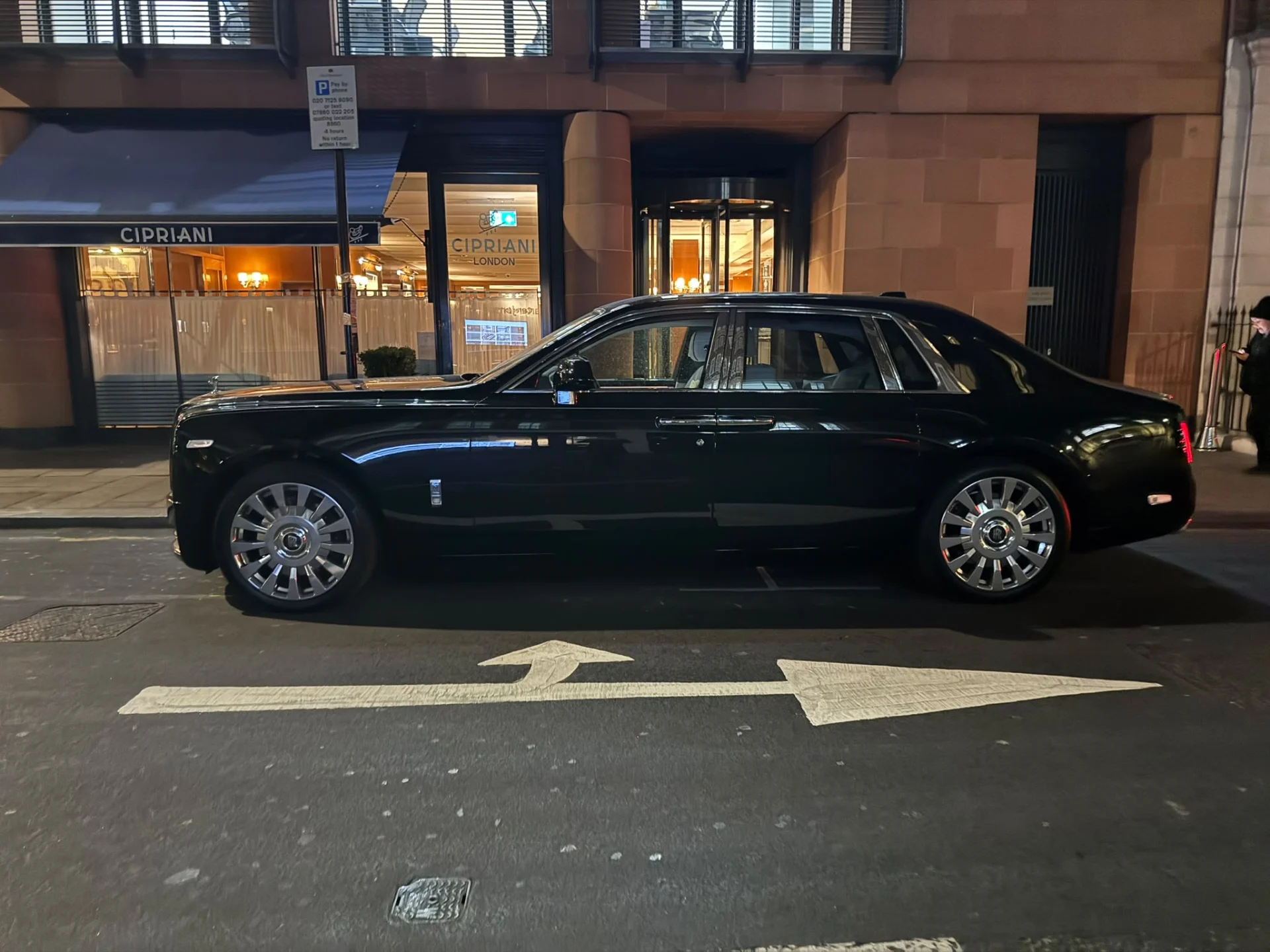 Rolls-Royce Phantom VIII luxury chauffeur vehicle parked outside Cipriani London restaurant on Davies Street Mayfair