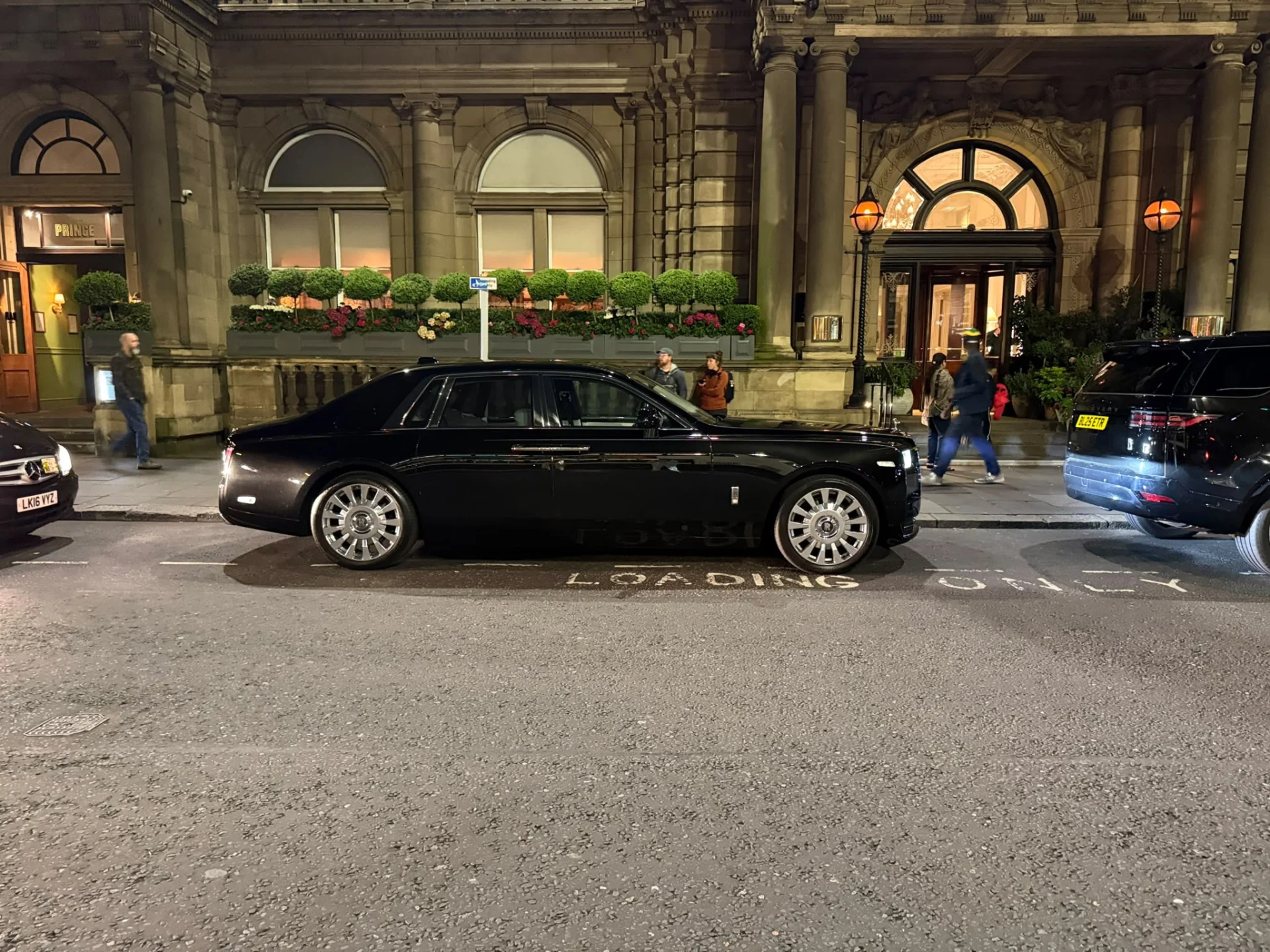 Rolls-Royce Phantom Mercedes S-Class and Range Rover luxury chauffeur vehicles at central London hotel forecourt